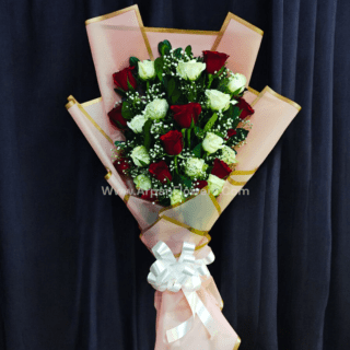 Red And White Rose Bouquet In Pink Paper