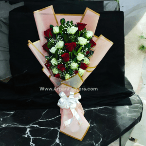 Red And White Rose Bouquet In Pink Paper