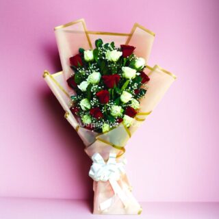 Red And White Rose Bouquet In Pink Paper