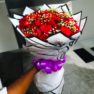 Red Rose in White Paper 1 Red rose with babys breath bouquet