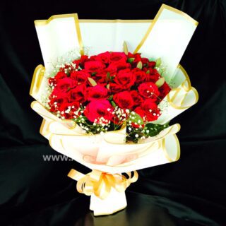 Red Rose With White Paper Packing With Baby's breath