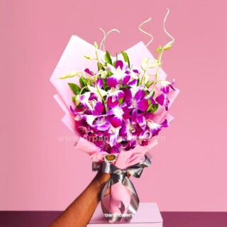 Purple orchid in pink Paper